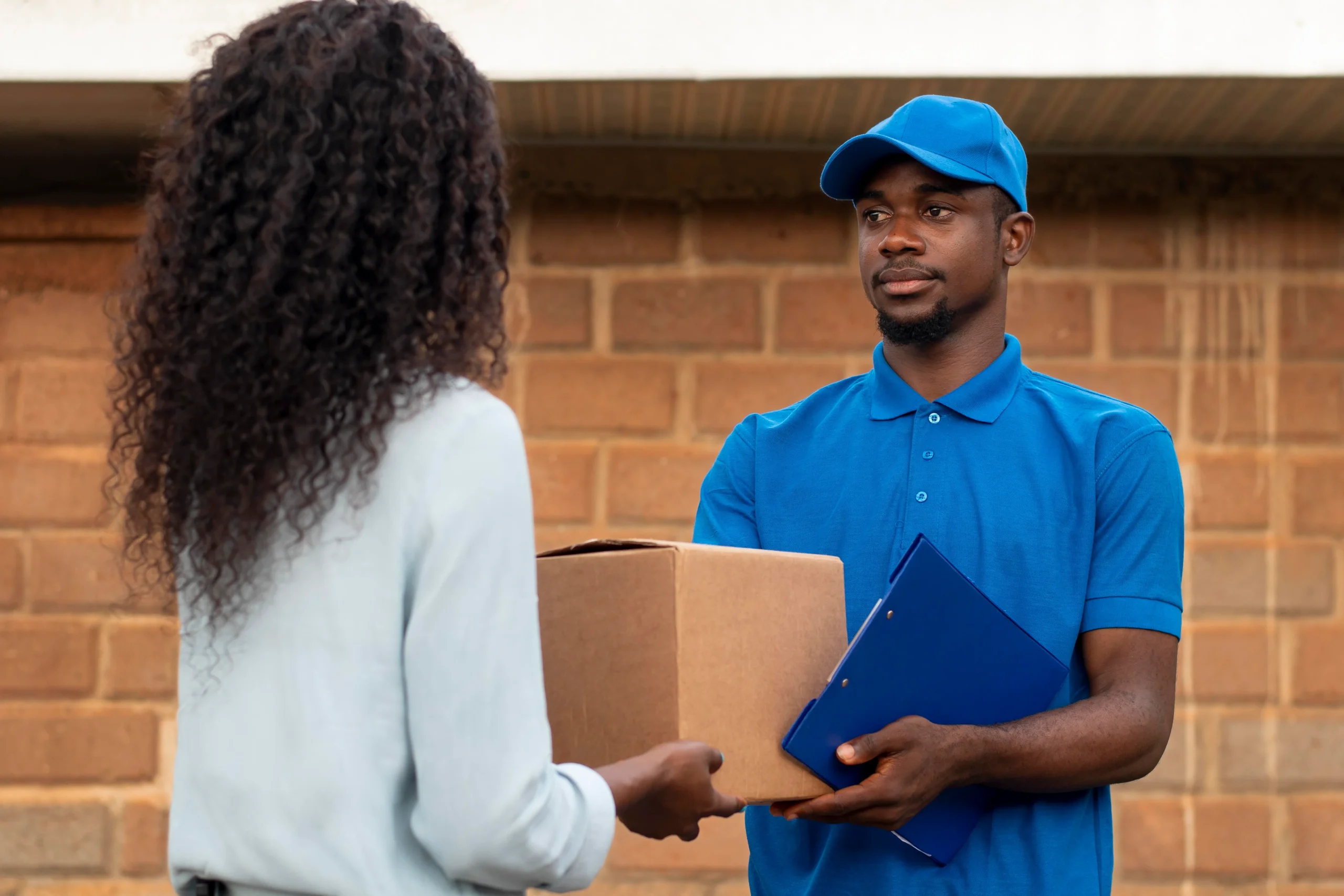 close-up-delivery-person-with-parcels.webp